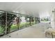 Covered carport with lush landscaping and ample space for parking at 3410 Spanish Oak Ter, Sarasota, FL 34237