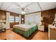 Spacious bedroom with wood floors and ceiling fan at 3410 Spanish Oak Ter, Sarasota, FL 34237