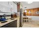 Retro kitchen with stainless steel appliances and a breakfast nook at 3410 Spanish Oak Ter, Sarasota, FL 34237