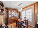 Charming dining room with wood hutch and seating for four at 3410 Spanish Oak Ter, Sarasota, FL 34237