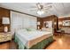 Spacious bedroom with a ceiling fan and en-suite bathroom at 3410 Spanish Oak Ter, Sarasota, FL 34237