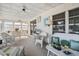 Bright sunroom with wicker furniture, perfect for relaxing at 3410 Spanish Oak Ter, Sarasota, FL 34237