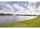 Community lake with fountain and lush landscaping at 1217 Blue Shell Loop, Sarasota, FL 34240