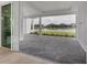 Spacious covered patio overlooking a lake and other homes at 1217 Blue Shell Loop, Sarasota, FL 34240