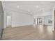 Large living area with hardwood floors and access to other rooms at 1217 Blue Shell Loop, Sarasota, FL 34240