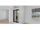 Open living space with light wood floors and a view into another room at 1217 Blue Shell Loop, Sarasota, FL 34240