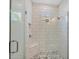 Modern bathroom featuring a large walk-in shower with white subway tile and a built-in seat at 1217 Blue Shell Loop, Sarasota, FL 34240