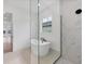 Spa-like bathroom with a soaking tub, walk-in shower, and glass enclosure at 1217 Blue Shell Loop, Sarasota, FL 34240