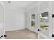 Bright home office features light hardwood floors and large windows at 1217 Blue Shell Loop, Sarasota, FL 34240