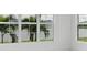 Spacious living area with expansive windows showcasing a scenic water view at 1217 Blue Shell Loop, Sarasota, FL 34240