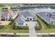 Aerial view of a luxury home with a large driveway and landscaping at 1217 Blue Shell Loop, Sarasota, FL 34240