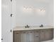 Double vanity bathroom with modern light fixtures at 1217 Blue Shell Loop, Sarasota, FL 34240
