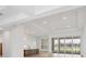 Open concept living area with kitchen, island, and access to the patio at 1217 Blue Shell Loop, Sarasota, FL 34240