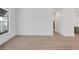 Bright and spacious living area with light hardwood floors at 1217 Blue Shell Loop, Sarasota, FL 34240