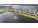 Aerial view of lakefront homes in a community at 1217 Blue Shell Loop, Sarasota, FL 34240