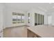 Bright dining area with large windows and hardwood floors at 1217 Blue Shell Loop, Sarasota, FL 34240