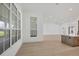 Light-filled dining area with hardwood floors and large windows at 1217 Blue Shell Loop, Sarasota, FL 34240