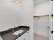 Bathroom featuring a vanity with dark countertop and a closet at 1217 Blue Shell Loop, Sarasota, FL 34240