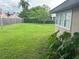 Large backyard with grassy area at 4015 Asbury Pl, Sarasota, FL 34233