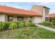 Charming home exterior with manicured landscaping, a paved walkway, and a cozy, inviting entrance at 6384 Draw Ln # 38, Sarasota, FL 34238