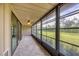 Screened lanai with tile flooring and views of the backyard at 6384 Draw Ln # 38, Sarasota, FL 34238