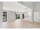 Open-concept living area boasts tile flooring, slider to lanai, and bar seating at 6384 Draw Ln # 38, Sarasota, FL 34238