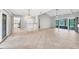 Spacious living room boasts travertine flooring and sliding doors leading to a lanai, perfect for indoor/outdoor living at 6384 Draw Ln # 38, Sarasota, FL 34238