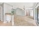 Open-concept living room with high ceilings and a breakfast bar at 6384 Draw Ln # 38, Sarasota, FL 34238