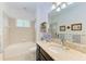 Clean bathroom with bathtub, vanity, and updated fixtures at 12105 Goldenrod Ave, Bradenton, FL 34212
