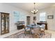 Cozy breakfast nook features a round glass table and wicker chairs at 12105 Goldenrod Ave, Bradenton, FL 34212