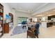 Spacious living room with built-in shelving, comfortable seating, and view of backyard pool at 12105 Goldenrod Ave, Bradenton, FL 34212