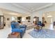 Spacious living room with a view into the kitchen and dining area at 12105 Goldenrod Ave, Bradenton, FL 34212