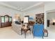 Living room with built-in bookshelves, comfortable seating and large windows at 12105 Goldenrod Ave, Bradenton, FL 34212