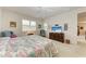 Spacious bedroom with large bed, comfortable seating, and plenty of natural light at 12105 Goldenrod Ave, Bradenton, FL 34212