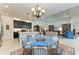Kitchen features an island with seating and dark cabinetry at 12105 Goldenrod Ave, Bradenton, FL 34212