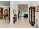 Spacious entryway with views into the living room and library at 12105 Goldenrod Ave, Bradenton, FL 34212