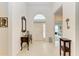 Bright and airy entryway with a console table and mirror at 12105 Goldenrod Ave, Bradenton, FL 34212