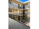 Condo building exterior showcasing multiple units and balconies at 2763 Woodgate Ln # 211, Sarasota, FL 34231