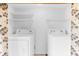 Laundry closet with washer and dryer, and shelving for storage at 1520 Pelican Point Dr # 251, Sarasota, FL 34231