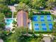 Aerial view of community pickleball courts and pool at 1520 Pelican Point Dr # 251, Sarasota, FL 34231