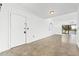 Bright entryway with tile floors and access to balcony at 1520 Pelican Point Dr # 251, Sarasota, FL 34231