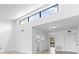 Open concept living area with high ceilings and view to kitchen at 1520 Pelican Point Dr # 251, Sarasota, FL 34231