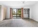 Spacious bedroom with sliding doors to balcony at 1520 Pelican Point Dr # 251, Sarasota, FL 34231