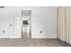 View through French doors showing a glimpse of the living area and waterfront at 1520 Pelican Point Dr # 251, Sarasota, FL 34231