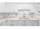 Modern white kitchen with sink and countertop at 1520 Pelican Point Dr # 251, Sarasota, FL 34231