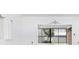 Living room with water view and sliding doors at 1520 Pelican Point Dr # 251, Sarasota, FL 34231