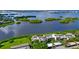Aerial view of waterfront property with lush landscaping and community at 1520 Pelican Point Dr # 251, Sarasota, FL 34231