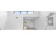 Open concept living area with high ceilings and view to kitchen at 1520 Pelican Point Dr # 251, Sarasota, FL 34231