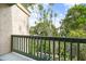 Private balcony overlooking lush landscaping and neighboring buildings at 1520 Pelican Point Dr # 251, Sarasota, FL 34231