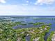 Aerial view of waterfront community with lush landscaping at 1520 Pelican Point Dr # 251, Sarasota, FL 34231